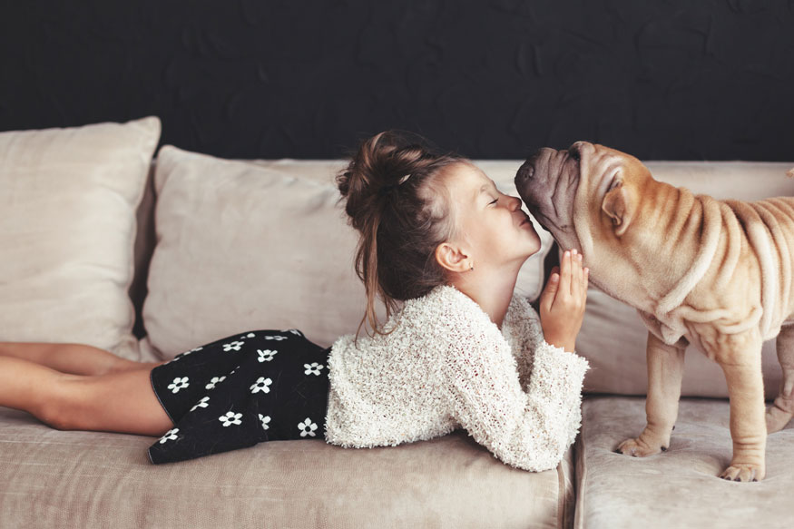 girl-and-dog-on-couch